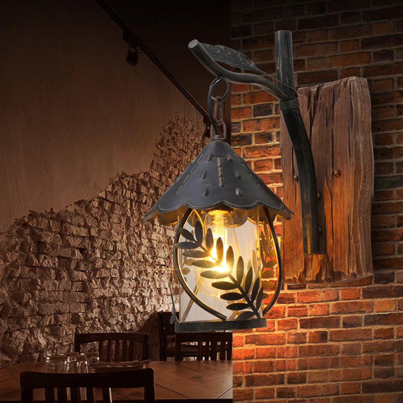Frendorf | Eine Wandleuchte mit einem Glaskolben und zylindrischem Schirm aus klarem Glas, industrielle Wandlampe für das Wohnzimmer mit Blattzweig in Schwarz