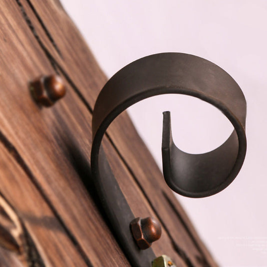 Frendorf | Eine Wandleuchte mit einem Glaskolben und zylindrischem Schirm aus klarem Glas, industrielle Wandlampe für das Wohnzimmer mit Blattzweig in Schwarz