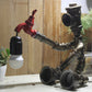 Metallic Sitzender Roboter Tischleuchte mit Wasserhahn Deco Steampunk 1 Licht Kinderzimmer Tischleuchte in Bronze/Silber