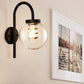 Frendorf | 1 Licht Globe Wandlamp Vintage Zwart/RVS Duidelijk Glas Wandlamp voor Slaapkamer met Koeiennek