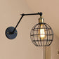 Frendorf | Schwarze Globe/Träne Wand sconce Beleuchtung mit Käfigschatten Retro Metall 1 Lichtarm verstellbare Wandmontage Licht