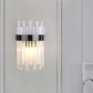 Frendorf | 2 Köpfe Schlafzimmer Wandlicht Postmodern Schwarz/Gold Wandlampe mit Halbzylinder Drei Seiten Kristallstangen-Schirm