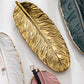 Nordic Light Luxury Stil auf goldener Federplatte Retro Schmuckplatte Aufbewahrung Platte Snack Platte Wohnkultur