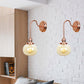 Frendorf | Vintage Globe Wandverlichting 1 Licht Duidelijk/Amber Glas Wandlamp in Koper met Bochtige Arm