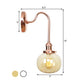 Frendorf | Vintage Globe Wandverlichting 1 Licht Duidelijk/Amber Glas Wandlamp in Koper met Bochtige Arm