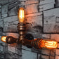 Frendorf | 2/3/4 Köpfe Expose Glühbirne Wandbeleuchtung mit Rohrdesign Rustikales Wetterkupfer Schmiedeeisen Wandlampe
