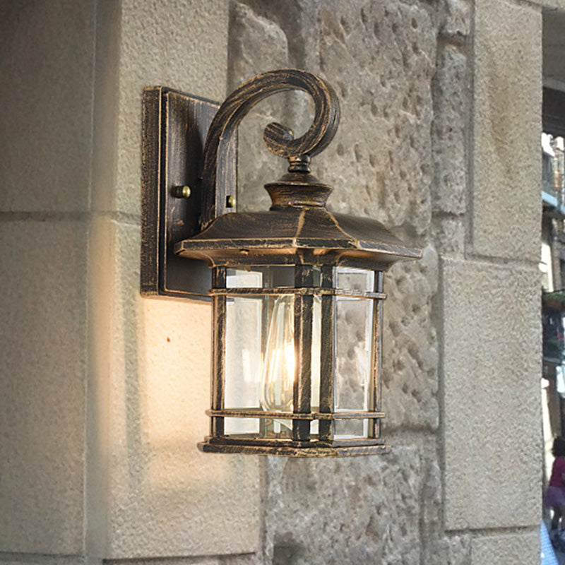 Frendorf | Bronze Curvy Arm Wandverlichting Platteland Helder Golfglas Enkelhoofd Buiten Wandlamp