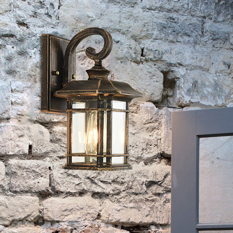 Frendorf | Bronze Curvy Arm Wandverlichting Platteland Helder Golfglas Enkelhoofd Buiten Wandlamp