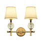Frendorf | 1/2-Kopf Schlafzimmer Wandlampe Modernismus Messing-Finish Klare Kristall Wandleuchte mit konischem Stoffschirm