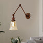 Frendorf | Ausladende Schlafzimmer Wandleuchte Retro-Stil Klar Glas 1 Licht Rost Wandlampe