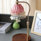 Moderne Art Deco Hebbare Glockenorchideen Eisen Glas Holz 1-Licht schmelzende Wachstischlampe für das Schlafzimmer