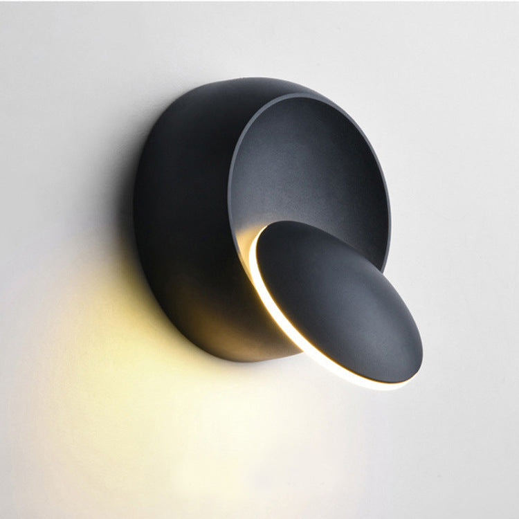 Zeitgenössische nordische Eisenrunde Eclipse drehbare LED Wandleuchte für Nachttisch