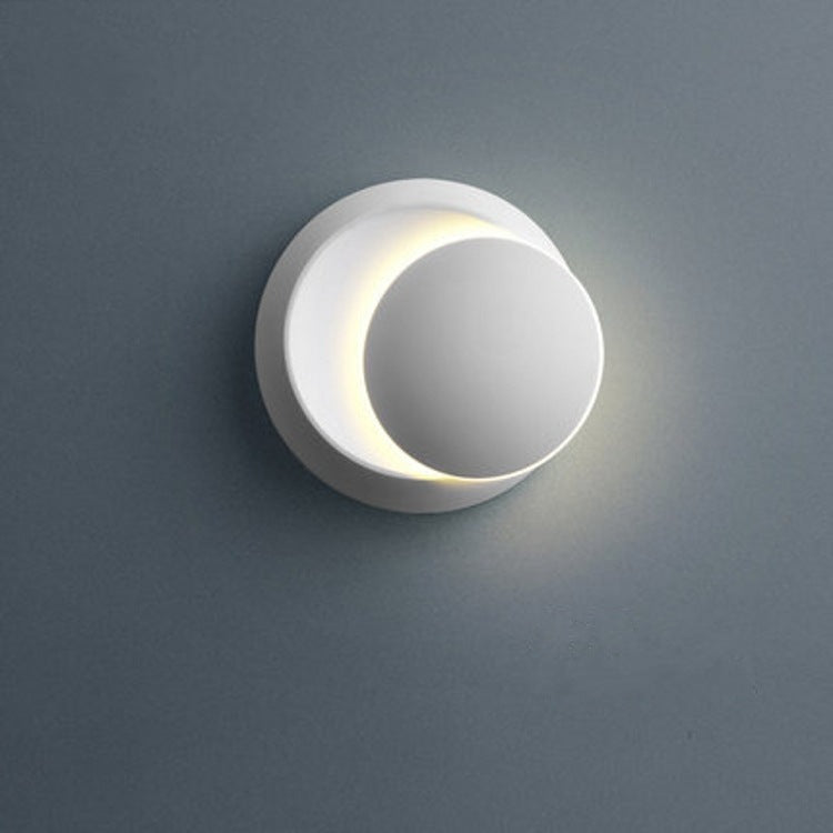 Zeitgenössische nordische Eisenrunde Eclipse drehbare LED Wandleuchte für Nachttisch