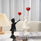 Banksy fliegende Ballon-Mädchen Statue