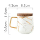 Marmormuster Kaffeetasse mit Goldverzierung