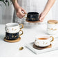 Marmormuster Kaffeetasse mit Goldverzierung