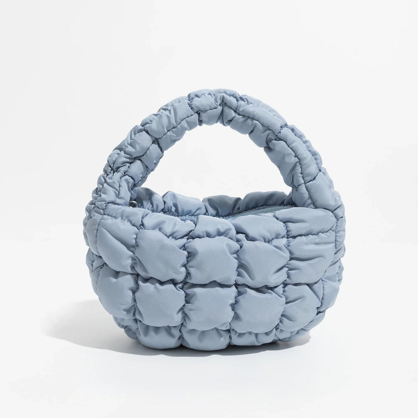 Lebhaftes kreuzgequiltetes rundes Mini-Tasche