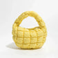 Lebhaftes kreuzgequiltetes rundes Mini-Tasche