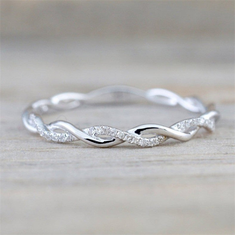 Frendorf | Geflochtener Ring mit Zirkonen in Gold und Silber