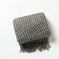 Gemütliche lila Diamant Strickdecke