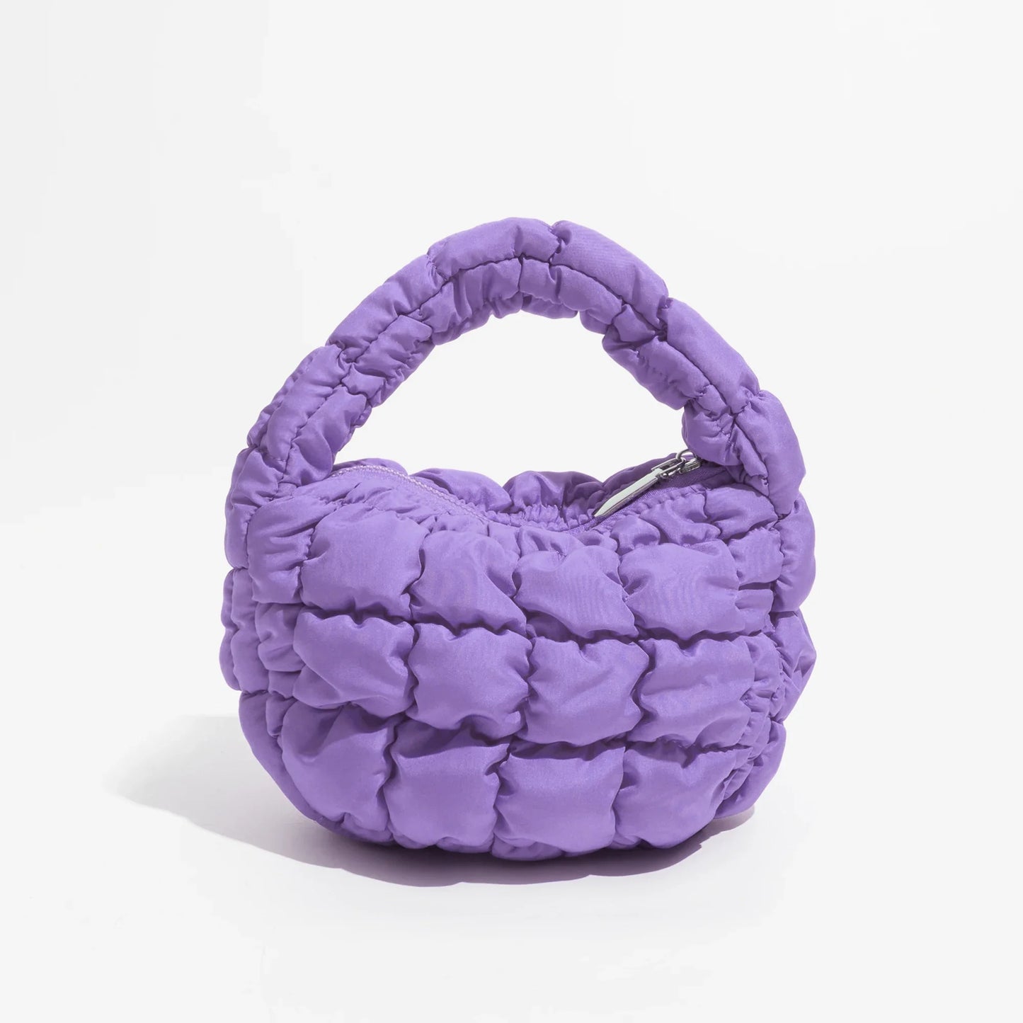 Lebhaftes kreuzgequiltetes rundes Mini-Tasche
