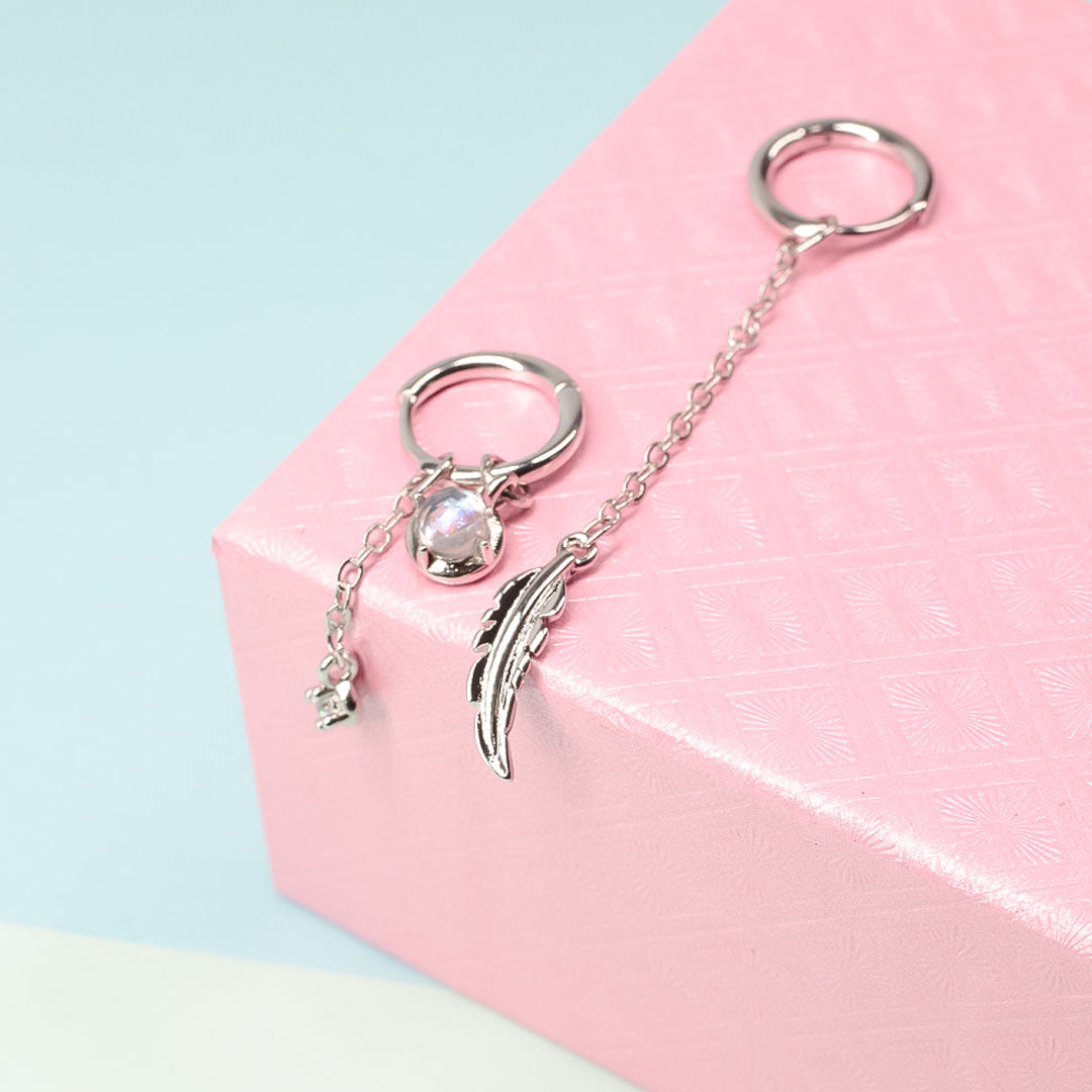 Frendorf | Federmondstein | Sterling Silber asymmetrische Feder Ohrringe, weißer Mondstein