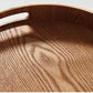 Schlanke, runde Serviertabletts aus Holz