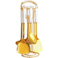 Goldene Küchenutensilien mit Ständer