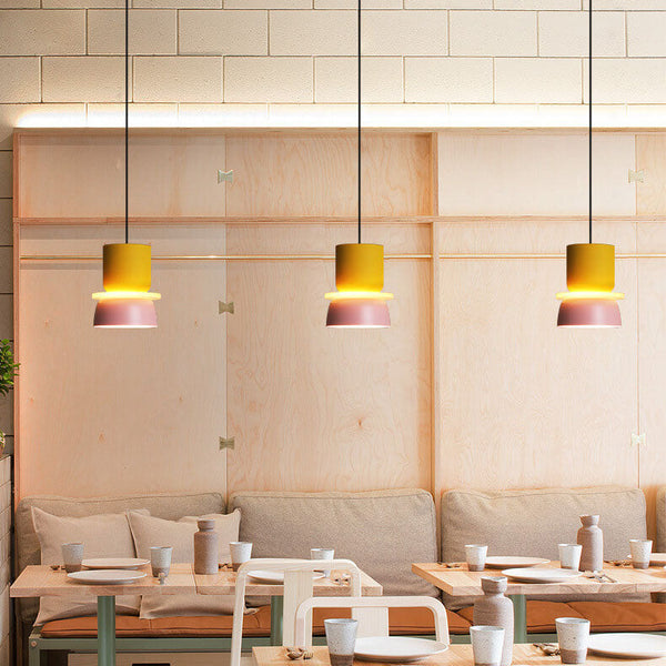 Pendant light illuminating a dining table area